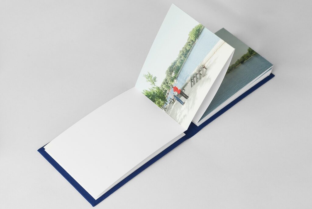 Photobook spread. A couple standing by a lakeside promenade in a city park, A Man in a Park