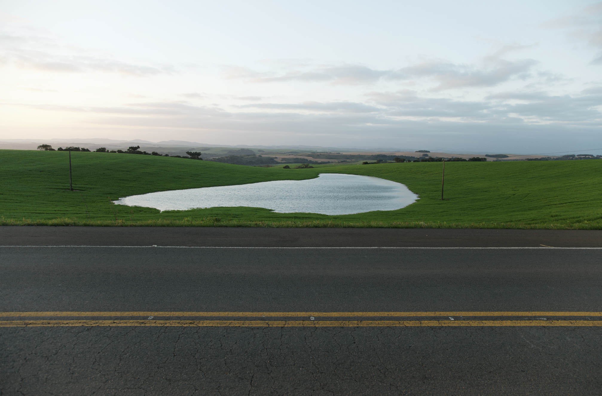 Open horizon, open sky, a lake, a road, Eufália, Southern Brazil